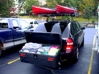 Acura MDX SUV with a StowAway Standard Cargo Box with lid open