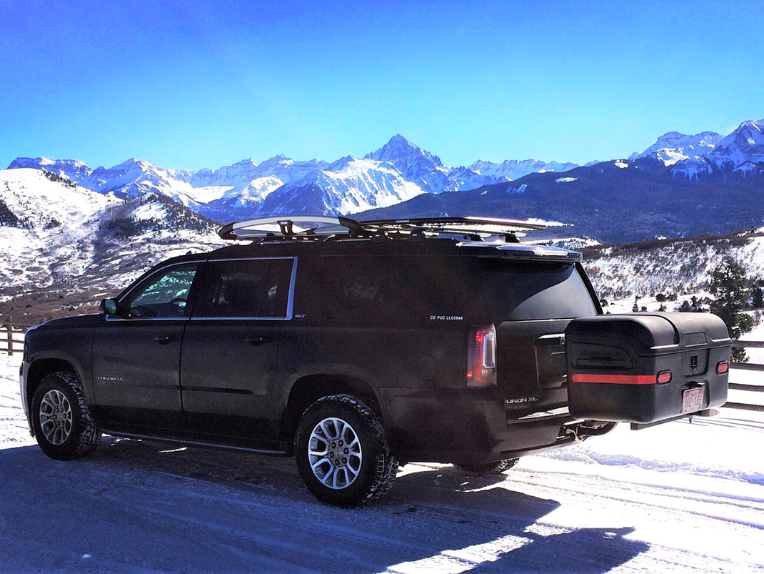 GMC Yukon with max hitch mount cargo carrier in telluride