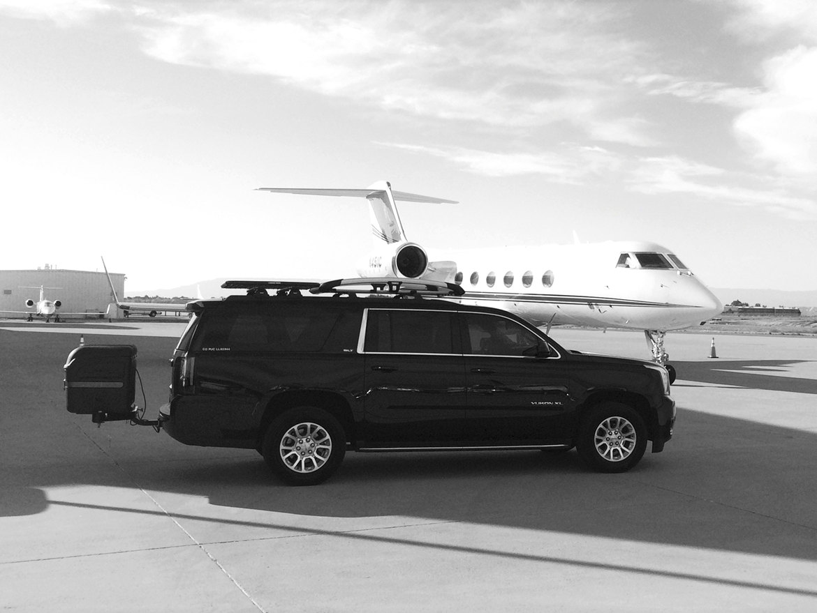 GMC Yukon with Stowaway Max Cargo Box at the airport.