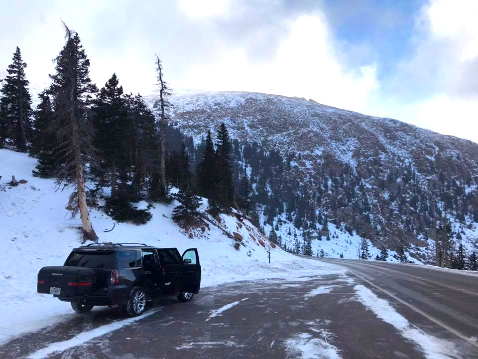 StowAway on GMC Yukon with Max Carrier in the snowy mountains.