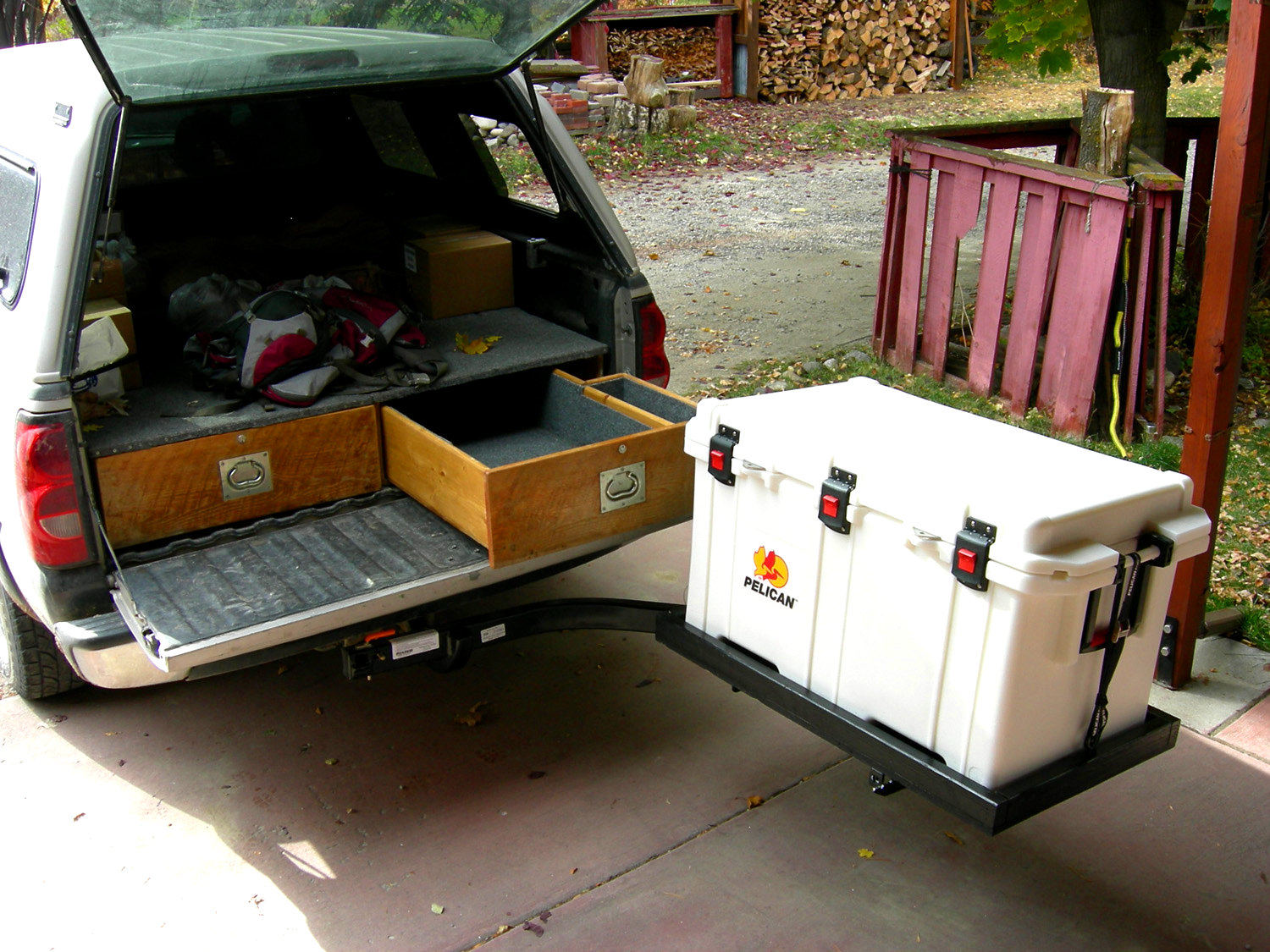 StowAway Swingaway Frame on Chevy truck carrying a pelican cooler..